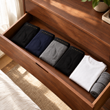 Garrison boxer briefs in Black, Navy and Gray folded in a drawer
