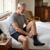 Man getting ready in the morning wearing the black Garrison boxer brief